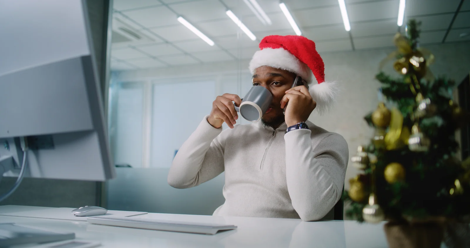 Someone taking a call at a desk in an otherwise empty office