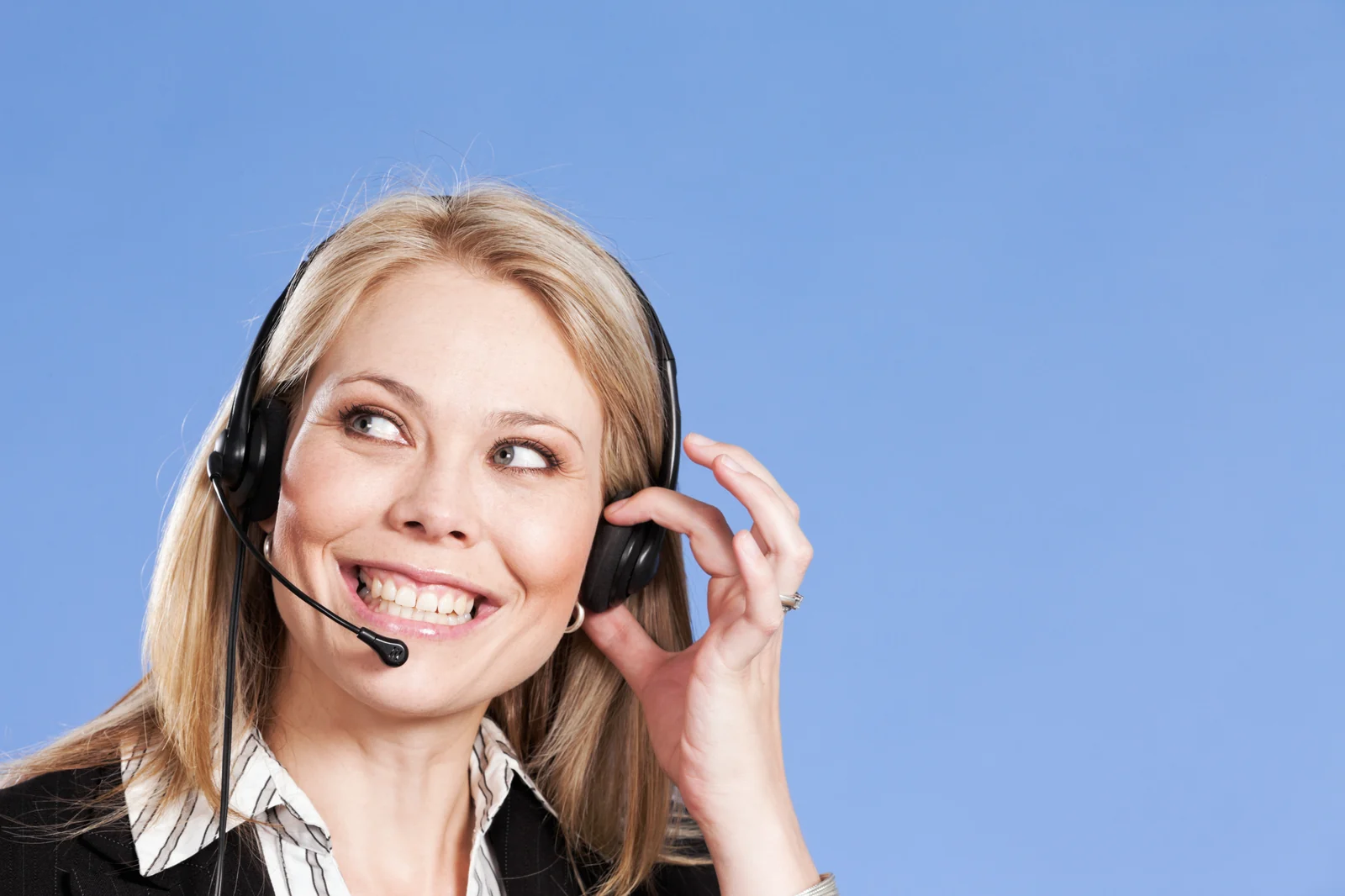 A support worker on a headset, mid call