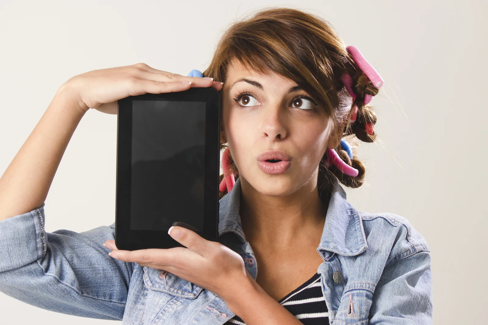 Someone holding a tablet at home