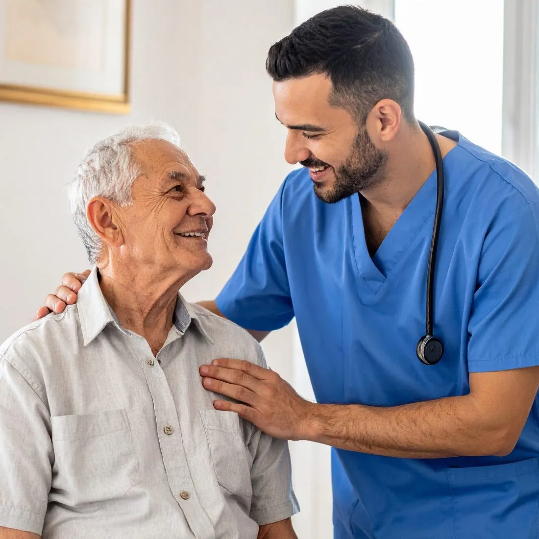 A nurse sitting with an older patient